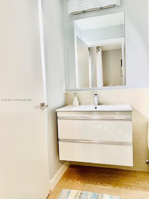 619 Meridian Avenue, Unit 4 Miami Beach, FL 33139 - Photo 24 of 30 a bathroom with a sink and a mirror