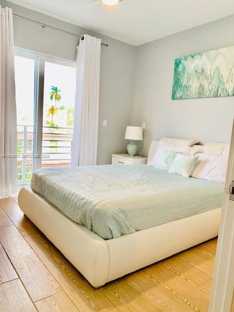 619 Meridian Avenue, Unit 4 Miami Beach, FL 33139 - Photo 27 of 30 a bedroom with a bed and window