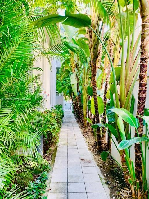 619 Meridian Avenue, Unit 4 Miami Beach, FL 33139 - Photo 3 of 30 a view of a garden with a pathway