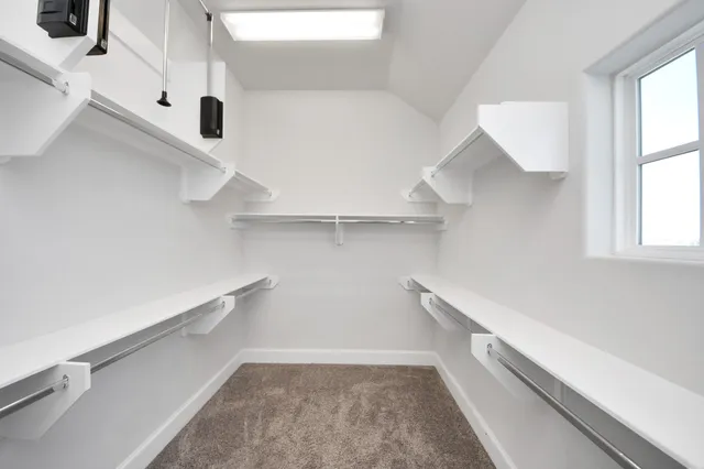 a view of a room with racks on the wall