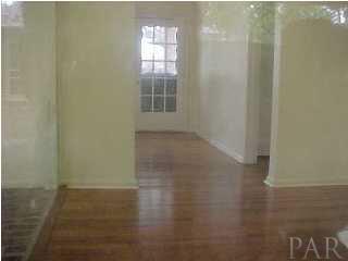 301 Payne Road Pensacola, FL 32507 - Photo 5 of 9 a view of a small space with wooden floor and a window