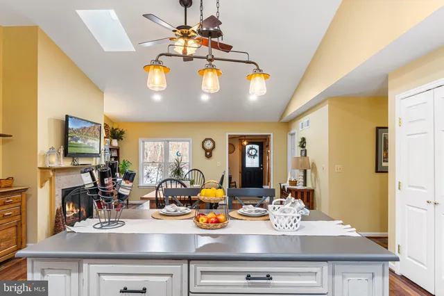 a view of a dining room with furniture and chandelier