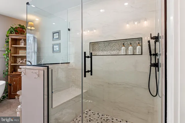 a bathroom with a shower and a shower