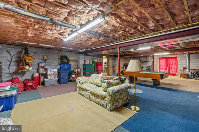 a view of a house with a yard covered in snow