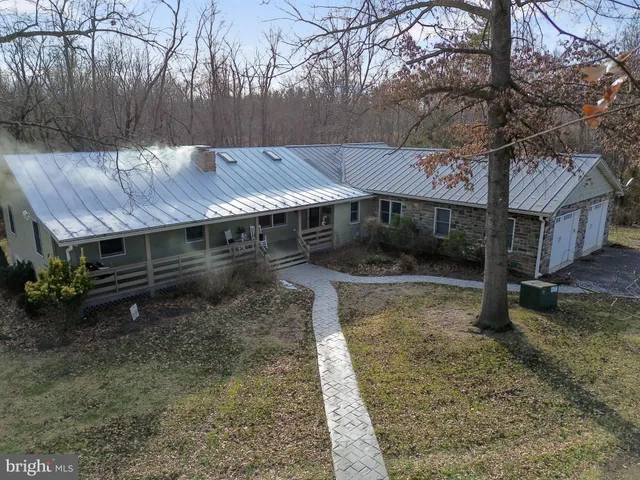 an aerial view of a house with mountain view