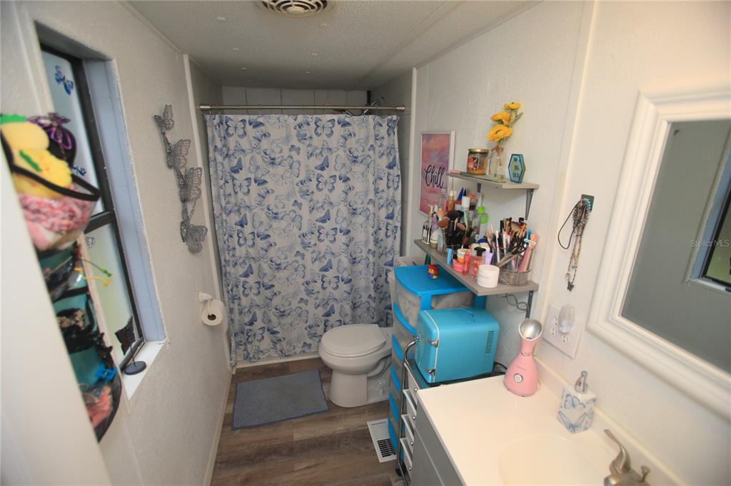 131 Southwest 76th Terrace Ocala, FL 34474 - Photo 19 of 27 a bathroom with a sink toilet and shower curtain