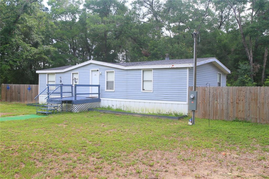131 Southwest 76th Terrace Ocala, FL 34474 - Photo 2 of 27 a view of a house with a yard and sitting area