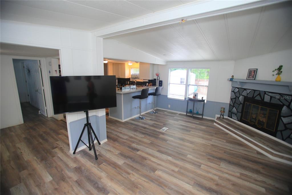 131 Southwest 76th Terrace Ocala, FL 34474 - Photo 6 of 27 a living room with furniture and a fireplace