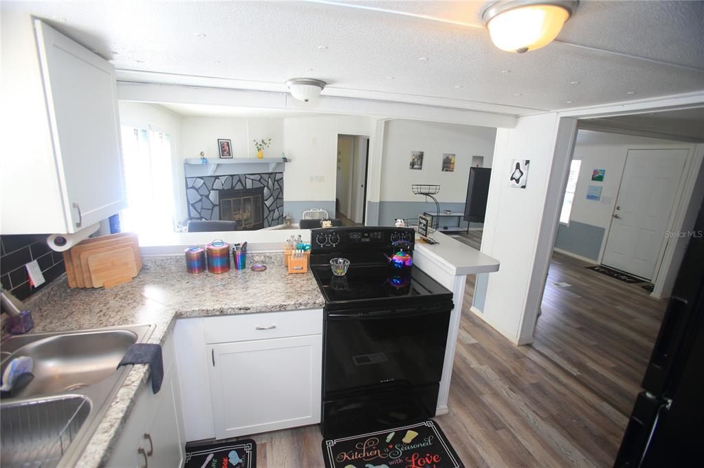 131 Southwest 76th Terrace Ocala, FL 34474 - Photo 10 of 27 a kitchen with a sink and a stove top oven