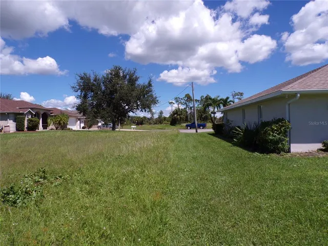 a view of a golf course with a house