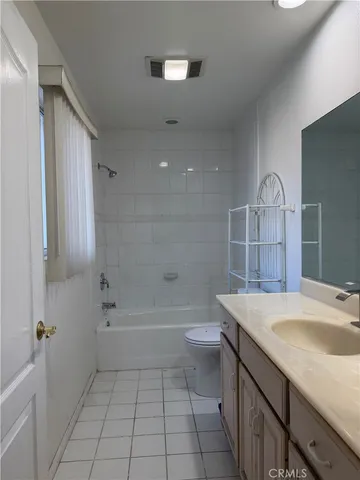 a view hallway with entryway and chandelier
