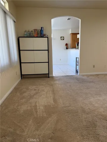 a kitchen with stainless steel appliances a sink stove and cabinets