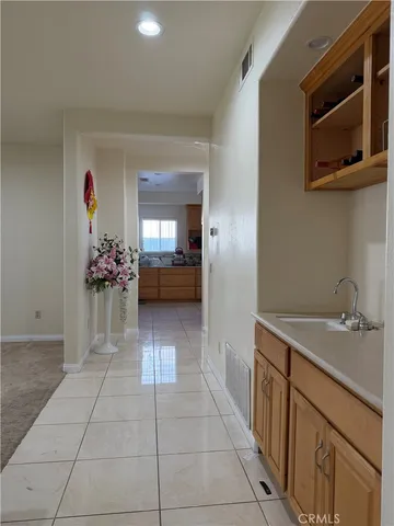 a kitchen with a sink and cabinets