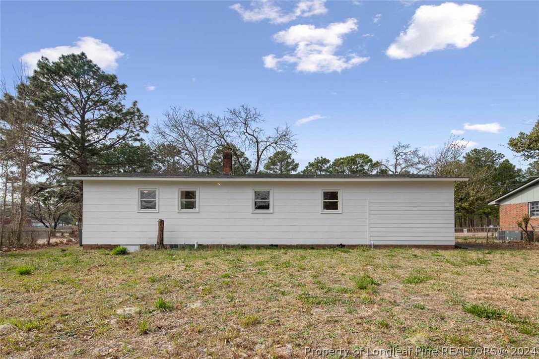 1604 Shaw Road Fayetteville, NC 28311 - Photo 2 of 30 a front view of house with yard and trees in the background