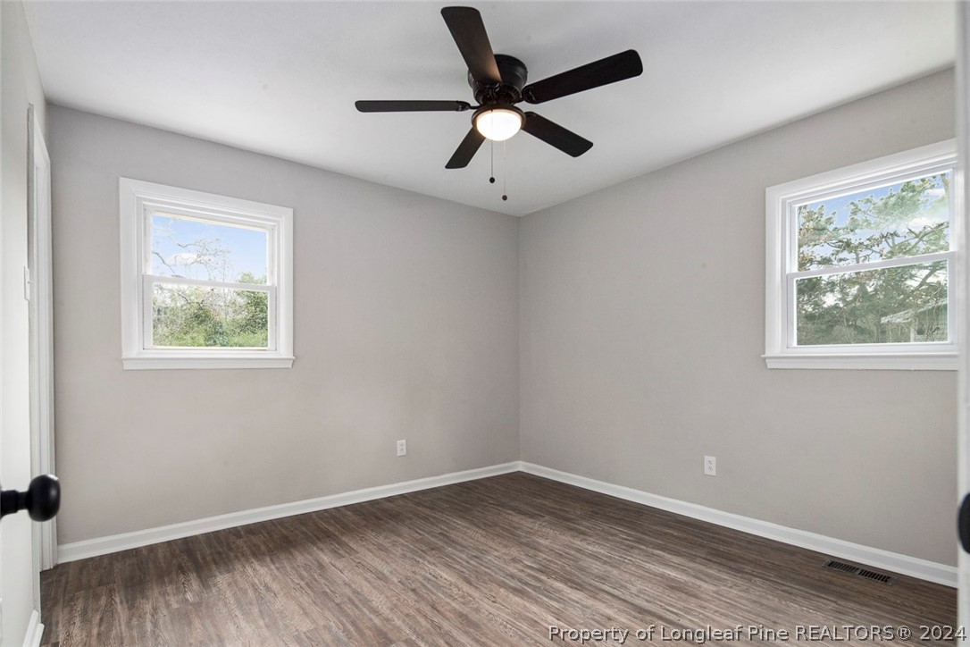1604 Shaw Road Fayetteville, NC 28311 - Photo 21 of 30 wooden floor in an empty room with a window