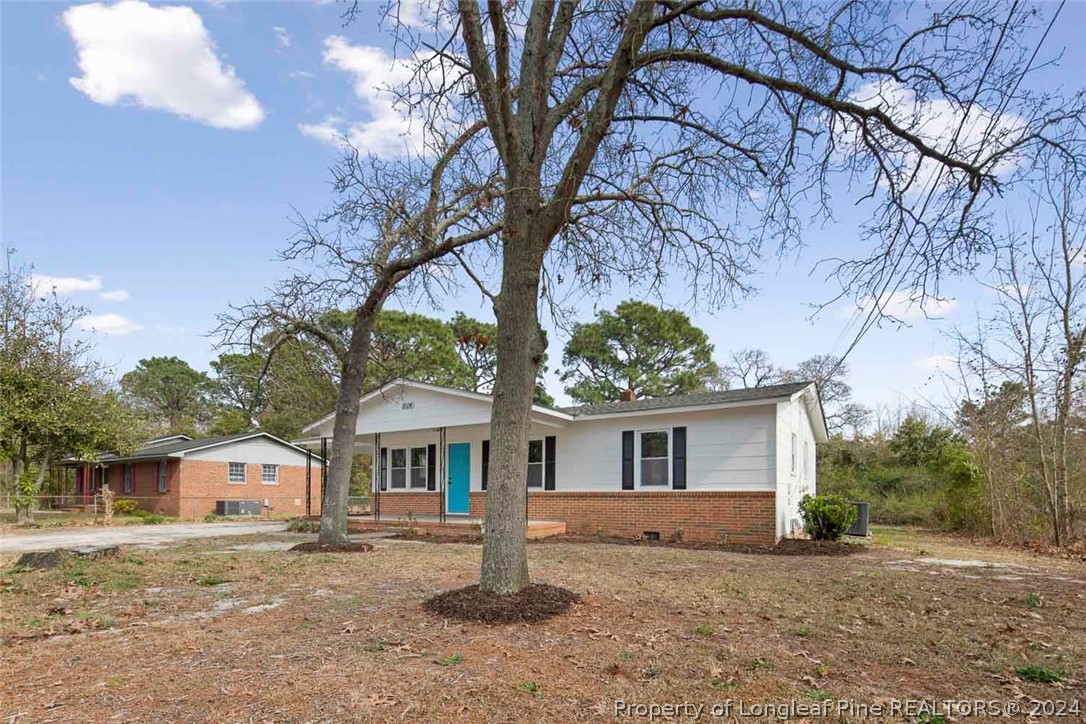 1604 Shaw Road Fayetteville, NC 28311 - Photo 3 of 30 front view of a house with a trees