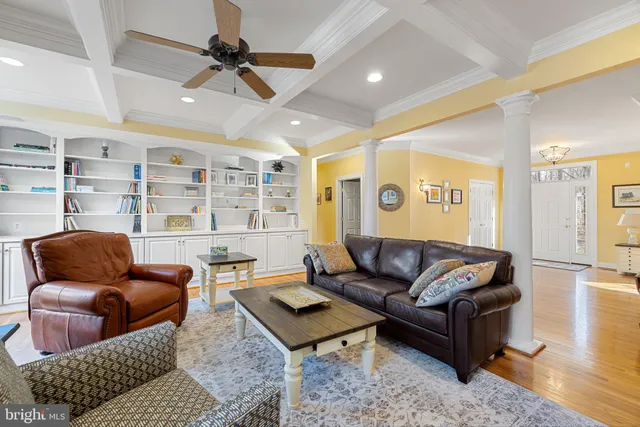 a view of a dining room with furniture wooden floor and chandelier