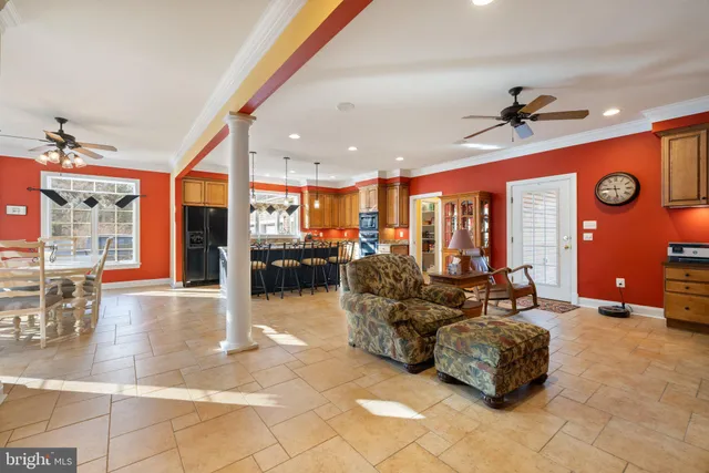 a dining room with furniture and window