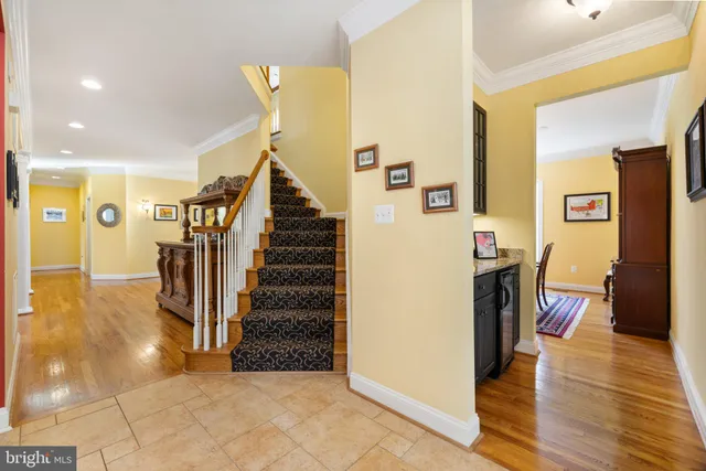 a view of walk in closet with clothes