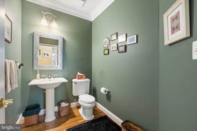 a bathroom with a glass shower door and a glass door