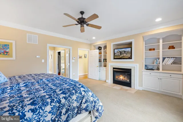 a view of a livingroom with a ceiling fan and window