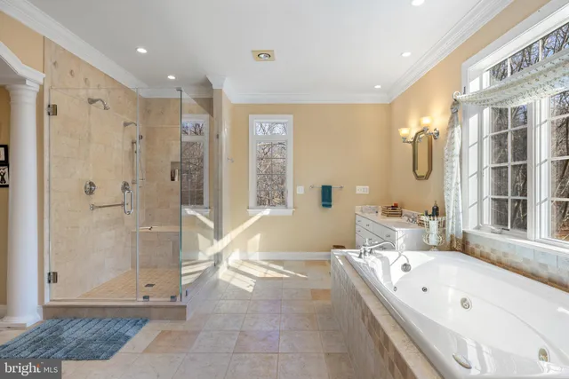 a room with pool table and windows