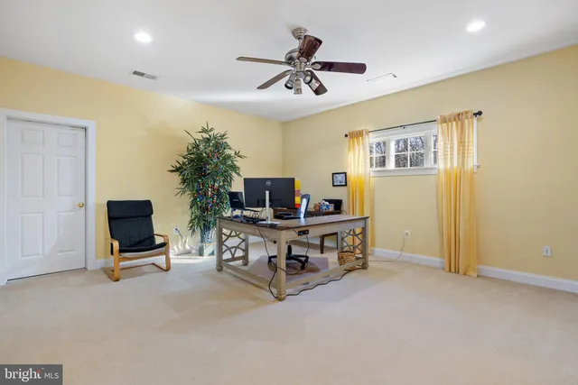 a bathroom with a sink a toilet and shower curtain