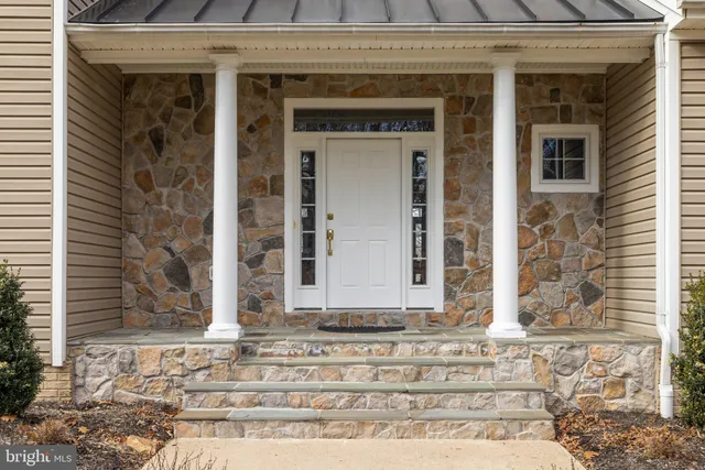 a view of a livingroom with furniture and hardwood floor