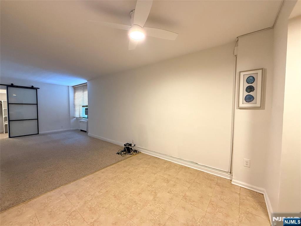 3091 Edwin Avenue, Unit 3D Fort Lee, NJ 07024 - Photo 3 of 11 an empty room with windows