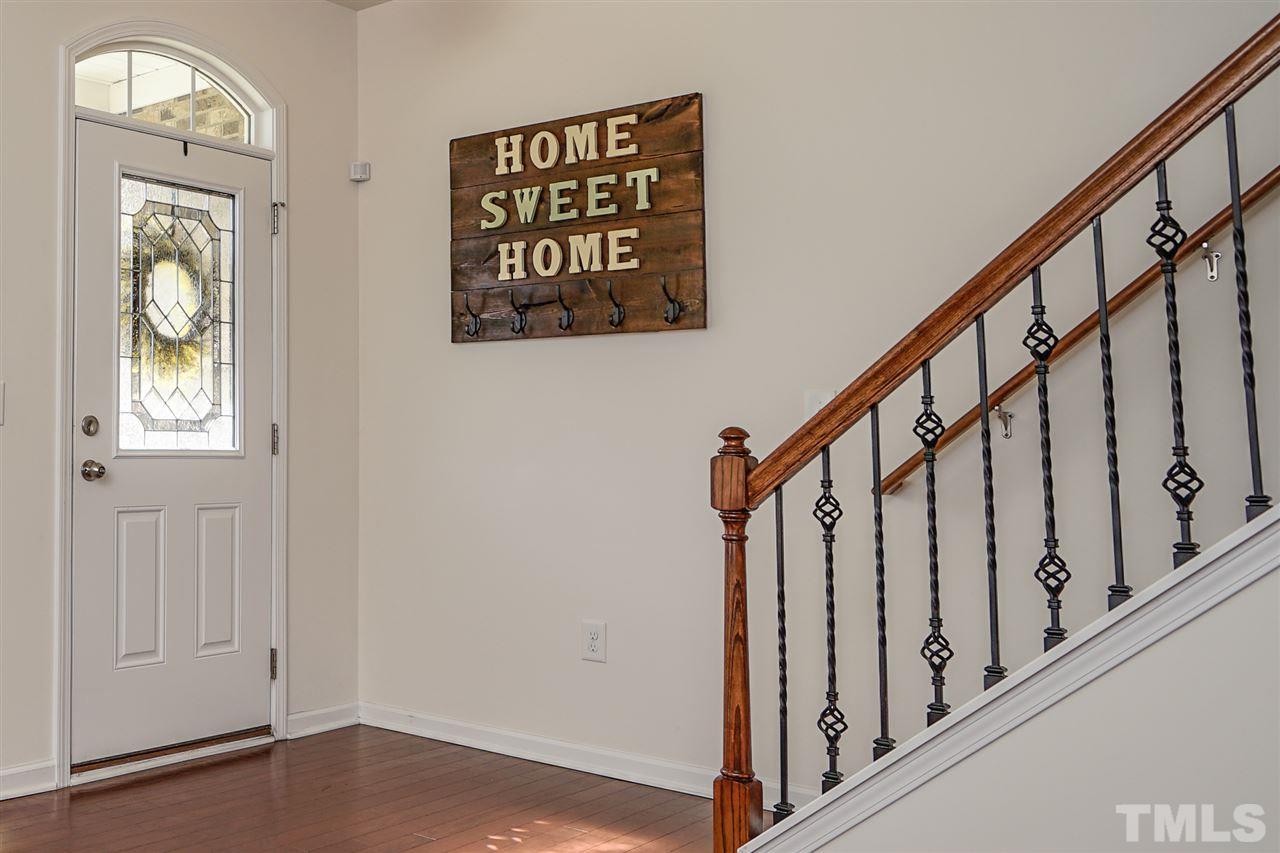 1604 Pattersons Mill Road Durham, NC 27703 - Photo 14 of 30 Front entry features hardwood flooring & wrought iron detail on railing.