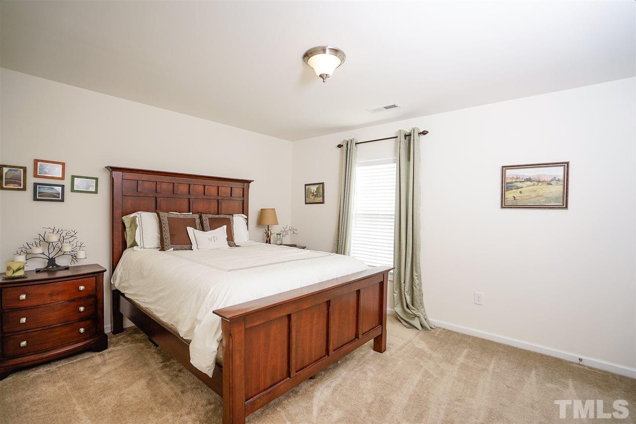 1604 Pattersons Mill Road Durham, NC 27703 - Photo 16 of 30 Large secondary bedroom features a WIC.