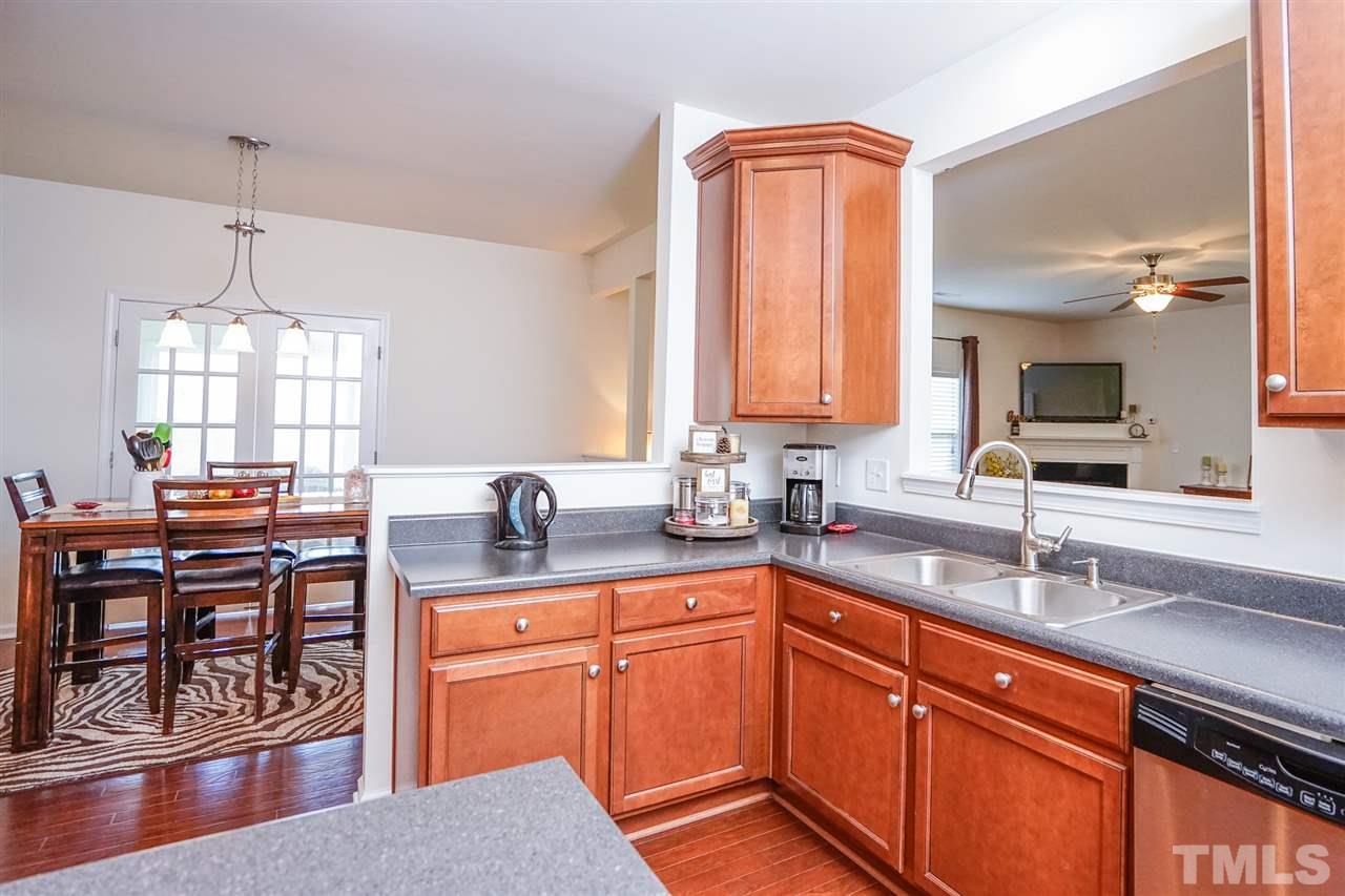 Stainless steel appliances and plenty of cabinets with added crown molding. Breakfast room right off the kitchen with easy access to the deck.