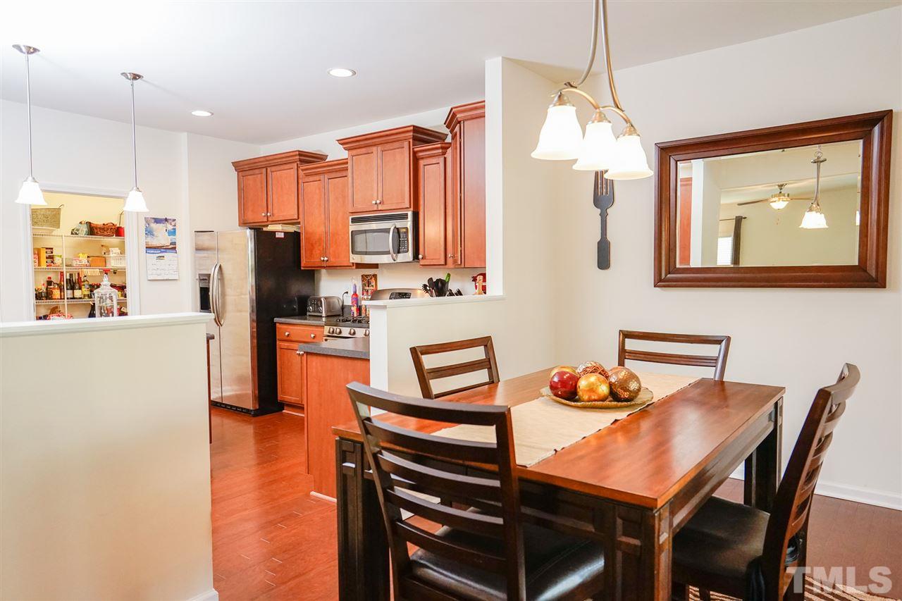 Breakfast area adjoins kitchen for informal meals. Separate formal dining room.