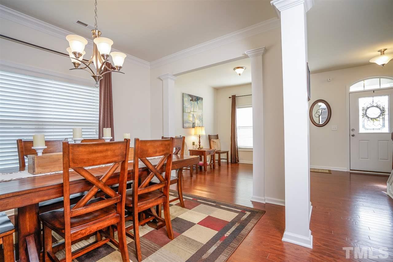 1604 Pattersons Mill Road Durham, NC 27703 - Photo 8 of 30 Formal dining room adjoins living room and features hardwood floors.