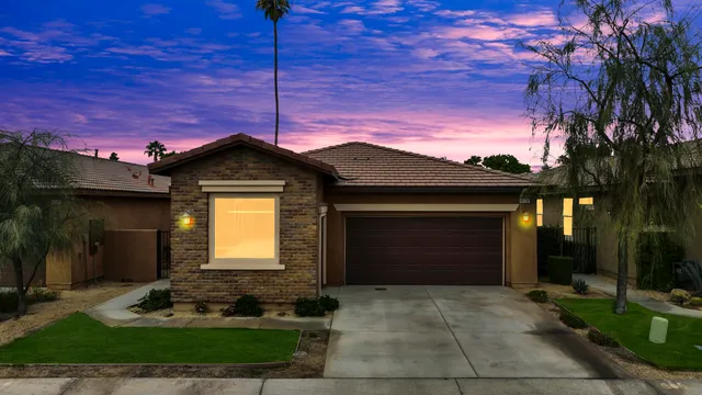 a front view of a house with yard