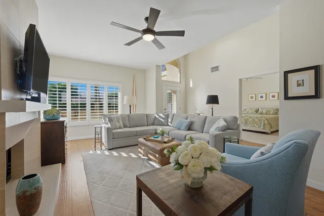 a living room with furniture fireplace and a flat screen tv