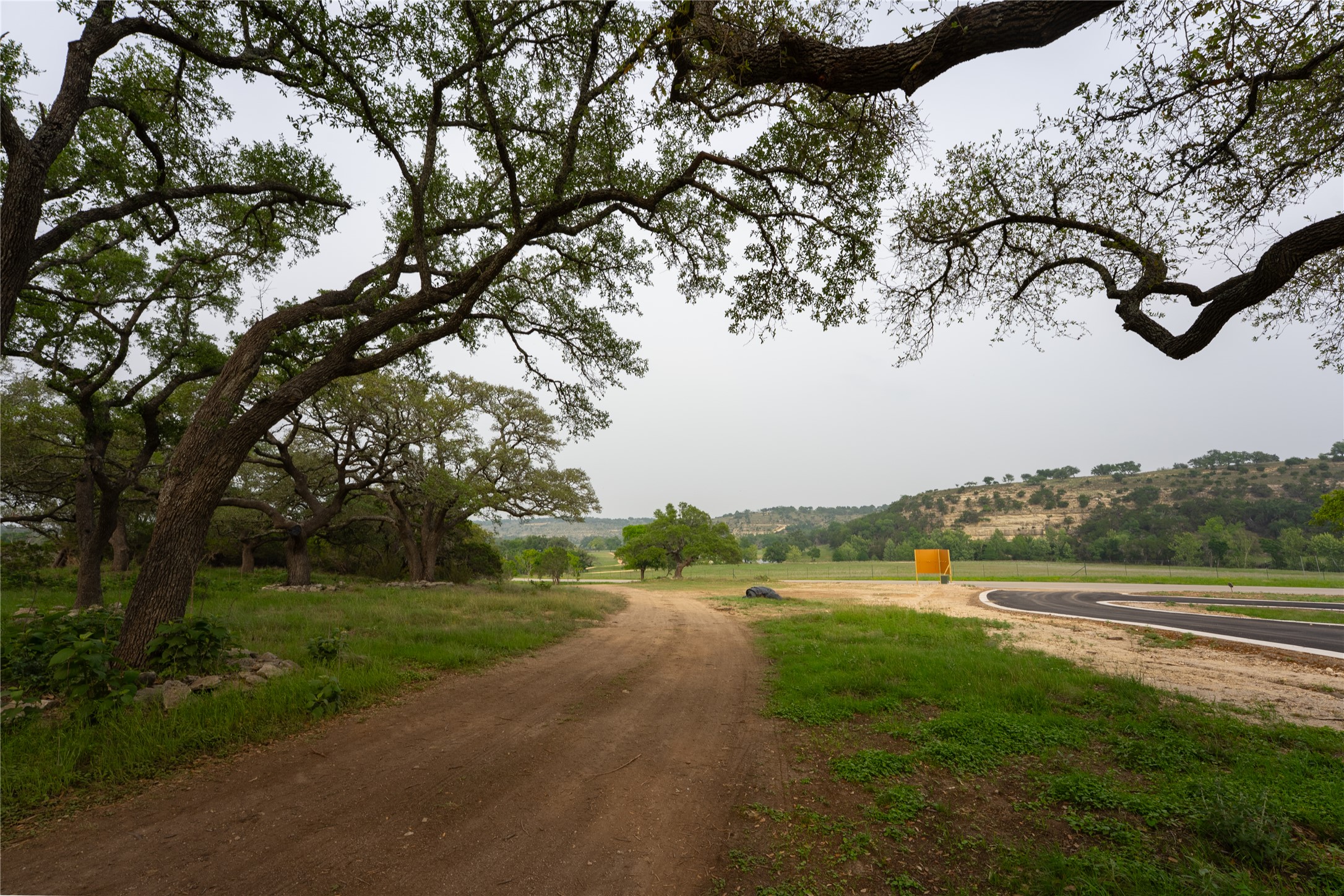 Lot 27 Ranch Road 165 Dripping Springs, TX 78620 - Photo 7 of 9 a view of a field of grass and trees