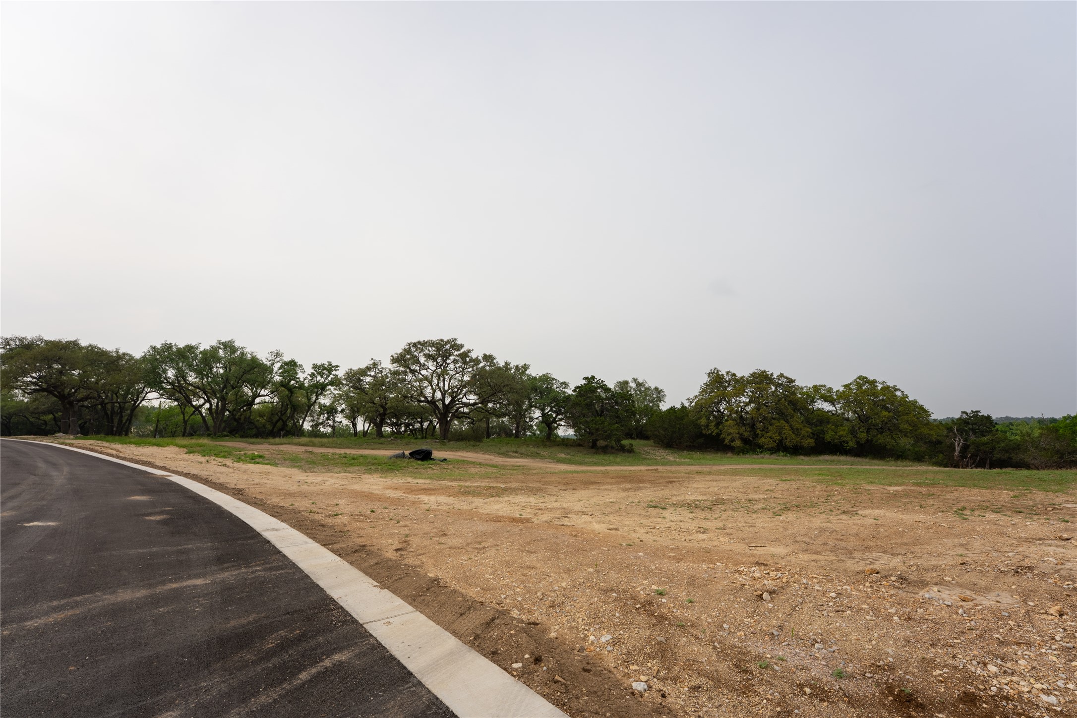 Lot 27 Ranch Road 165 Dripping Springs, TX 78620 - Photo 9 of 9 a view of a grassy area with an ocean