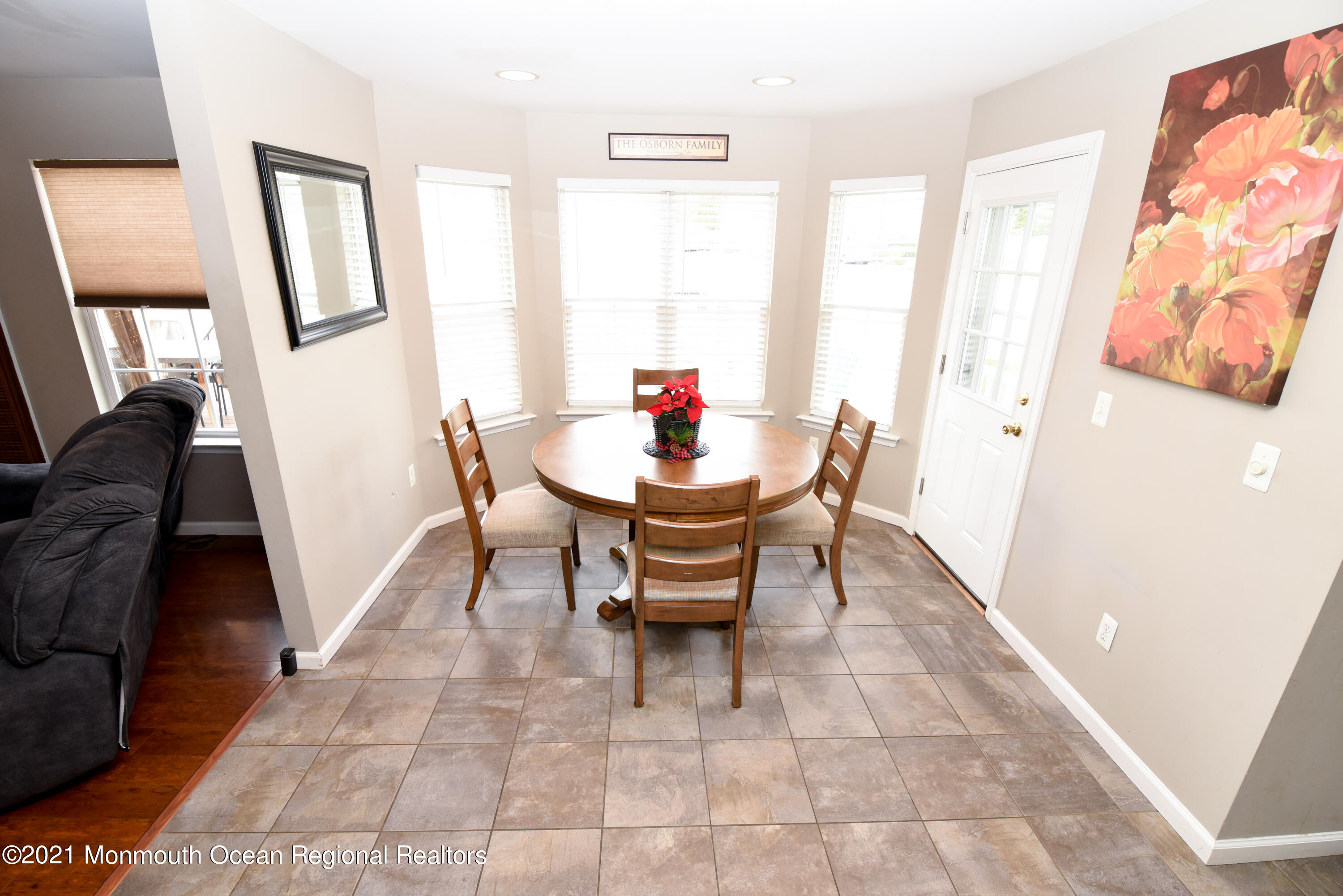 57 Mutineer Avenue Barnegat, NJ 08005 - Photo 20 of 89 a living room with furniture and a large mirror next to a window