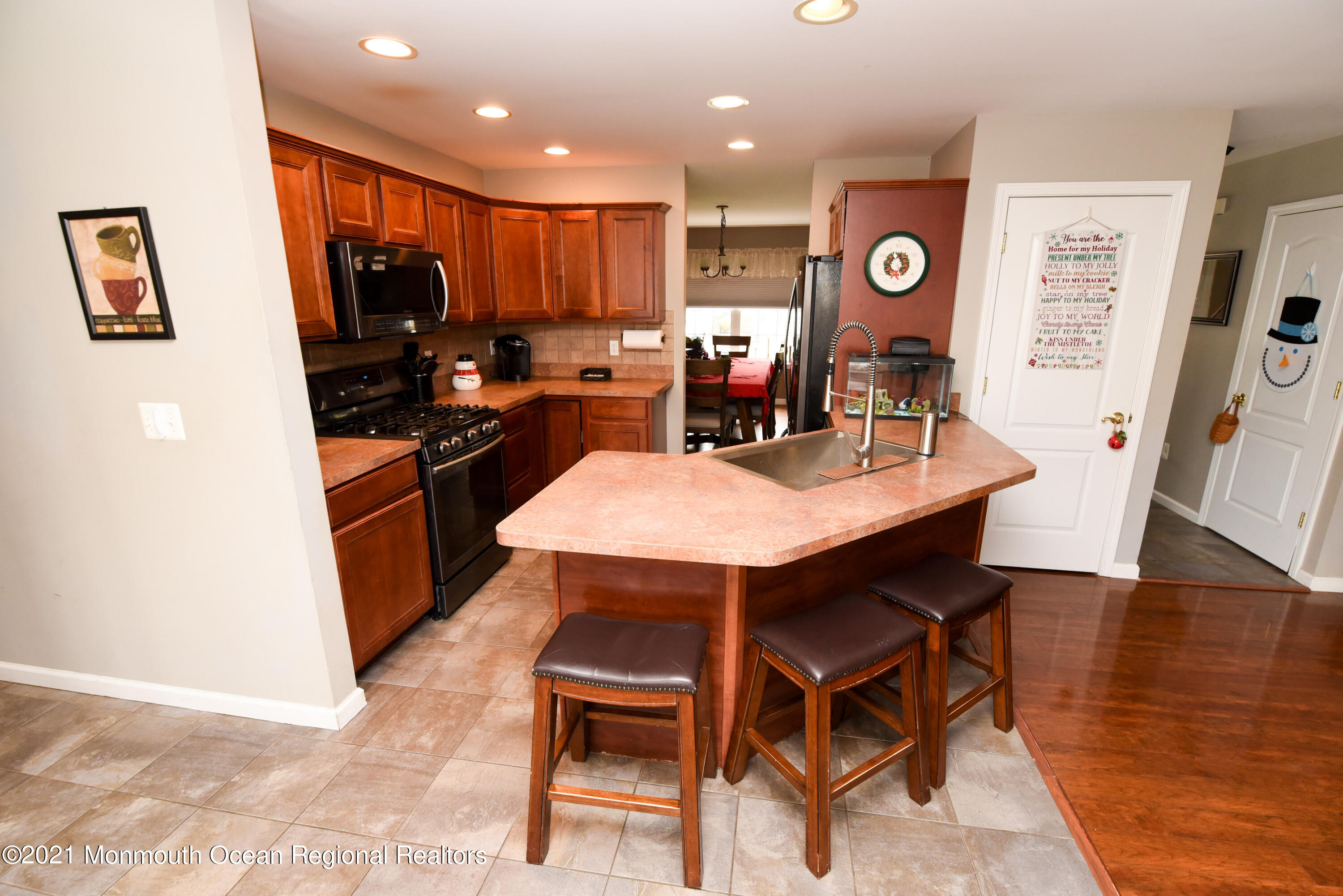 57 Mutineer Avenue Barnegat, NJ 08005 - Photo 28 of 89 a living room with stainless steel appliances kitchen island granite countertop furniture and a dining table
