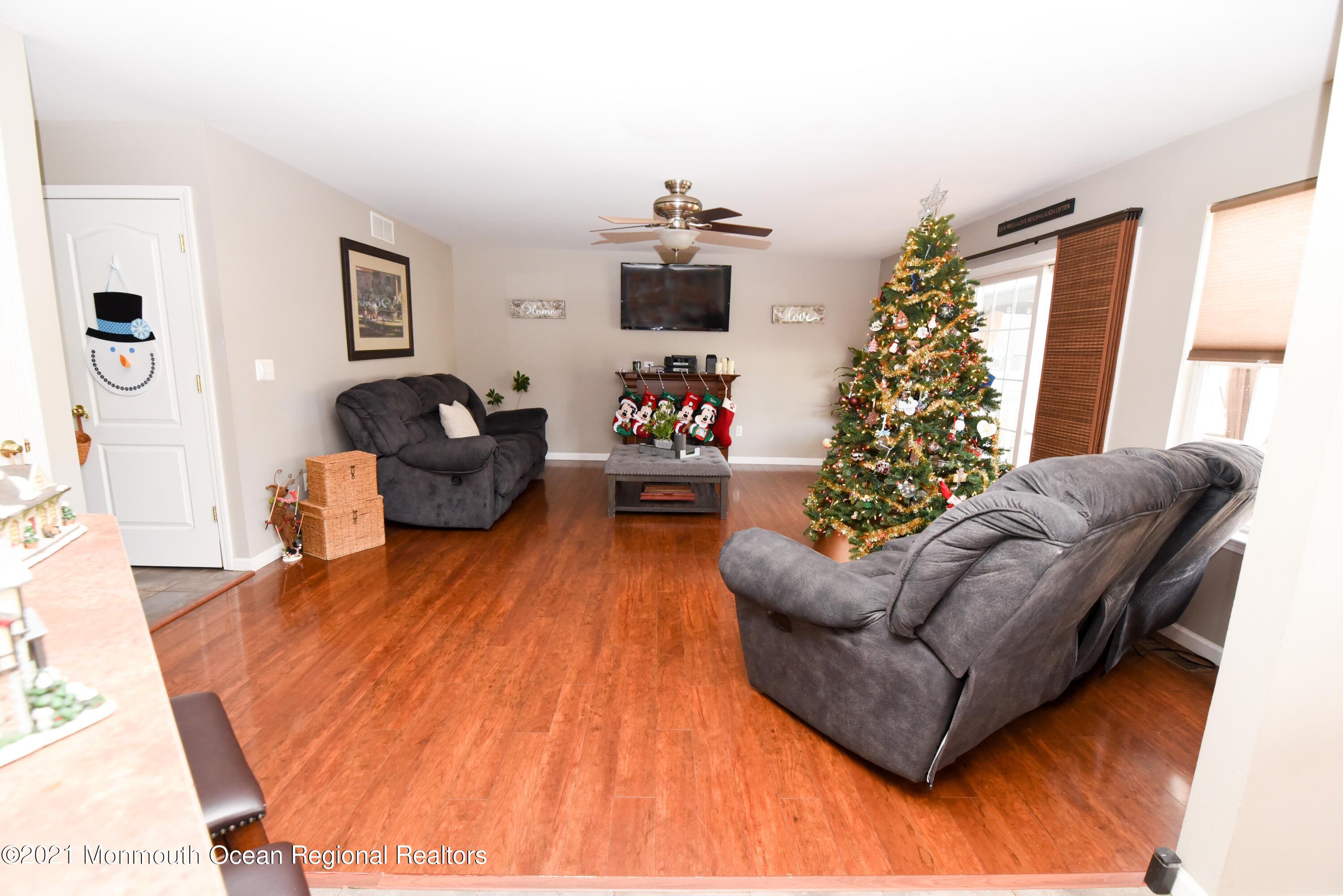 57 Mutineer Avenue Barnegat, NJ 08005 - Photo 31 of 89 a living room with furniture and a flat screen tv