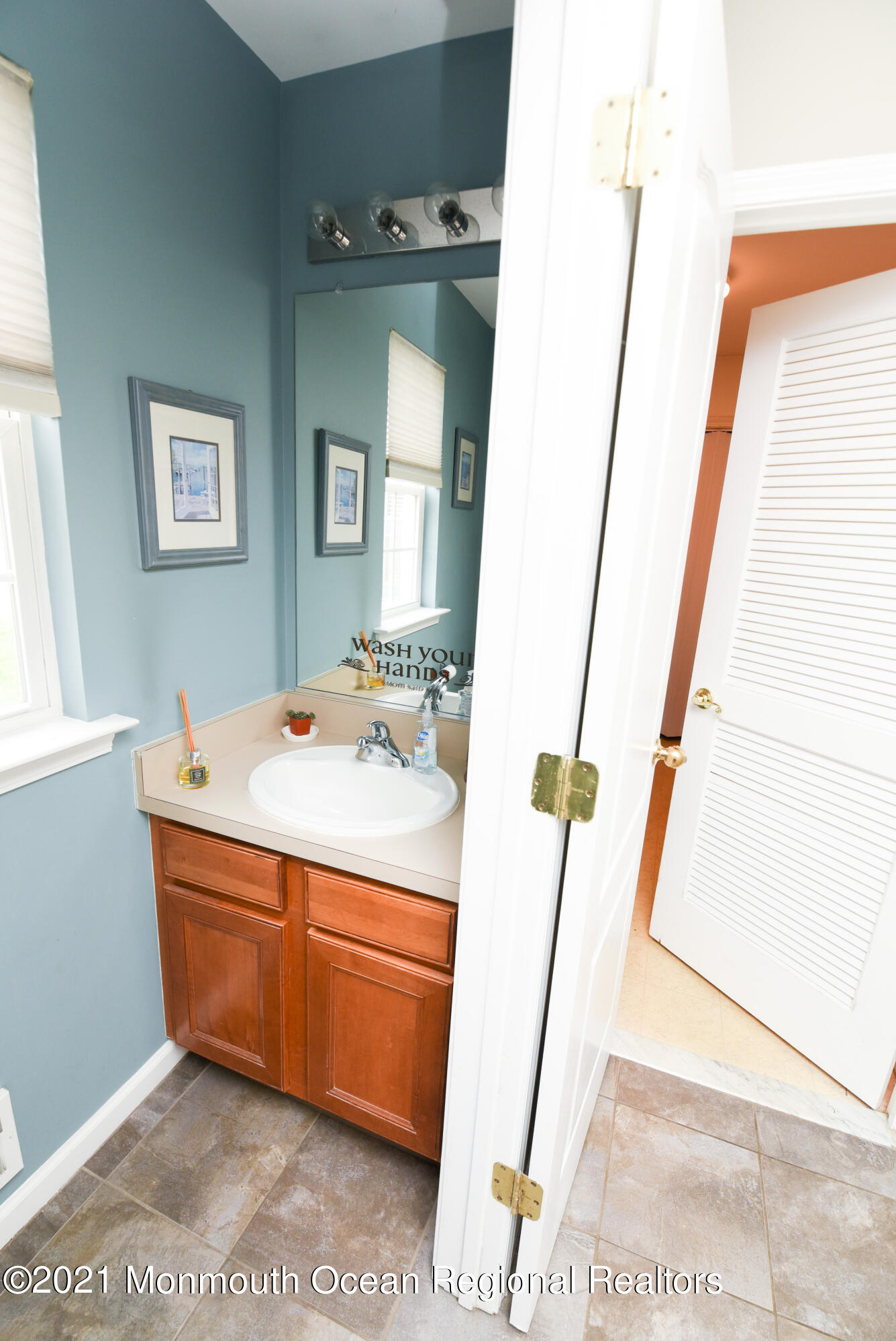 57 Mutineer Avenue Barnegat, NJ 08005 - Photo 34 of 89 a bathroom with a sink a mirror and a shower