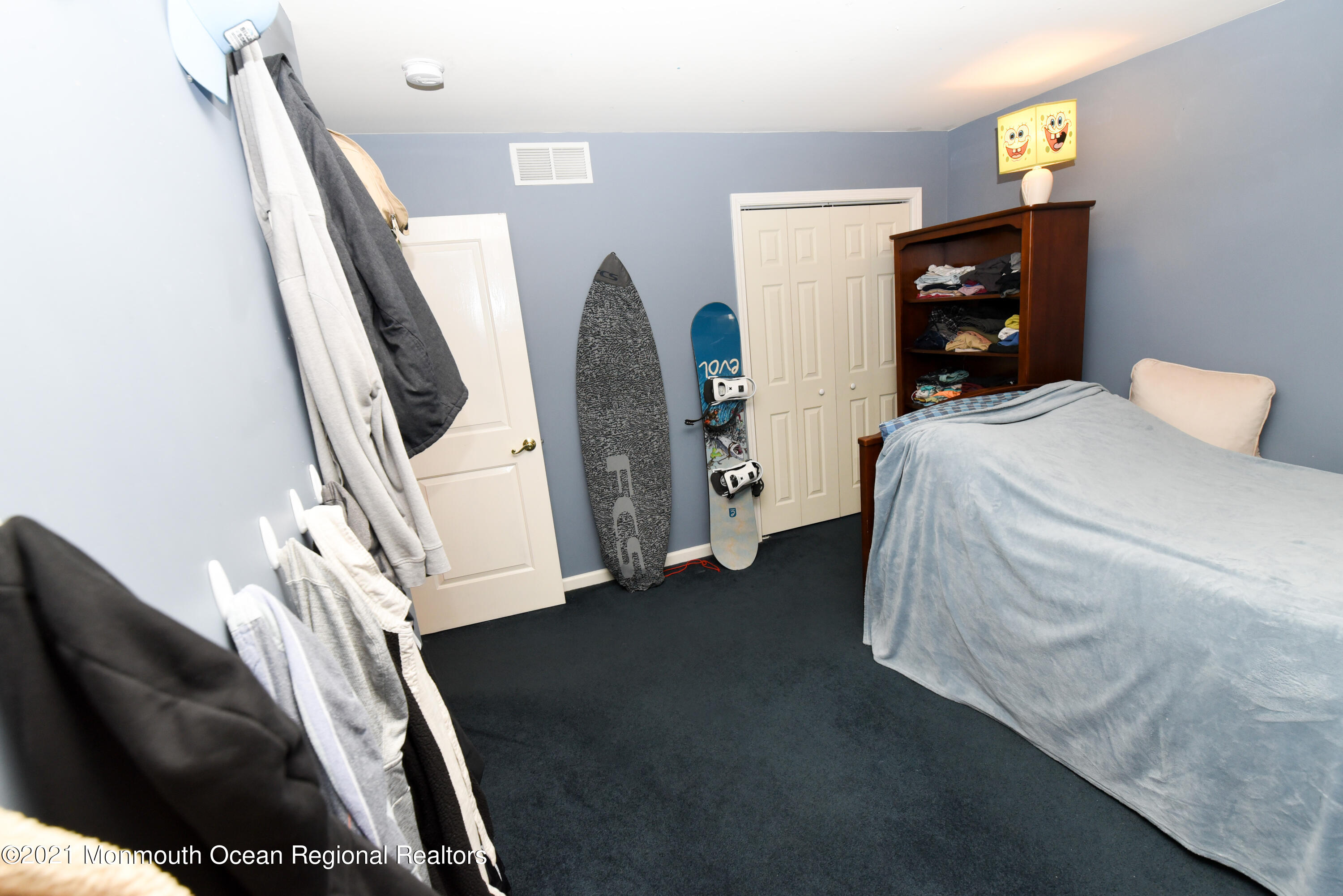 57 Mutineer Avenue Barnegat, NJ 08005 - Photo 52 of 89 a bedroom with a bed and a flat tv screen on the dresser