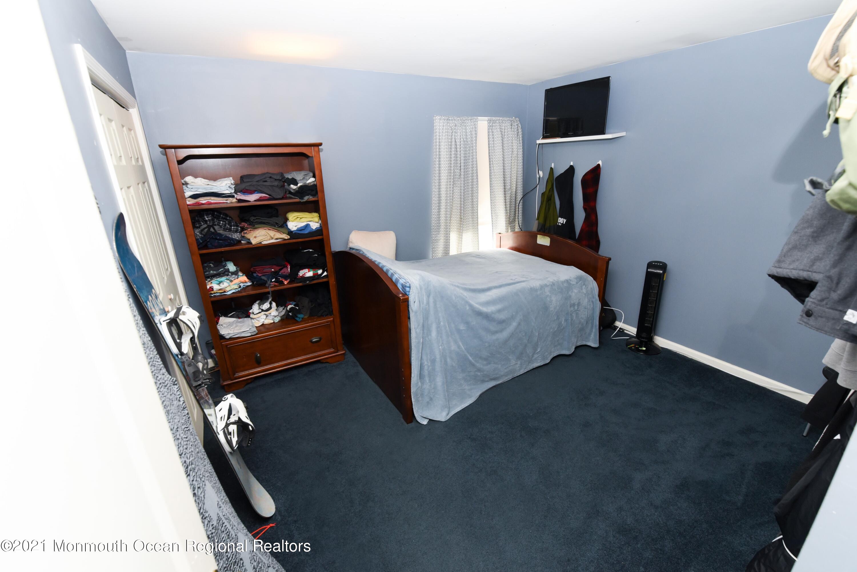 57 Mutineer Avenue Barnegat, NJ 08005 - Photo 53 of 89 a bed room with a bed and a television