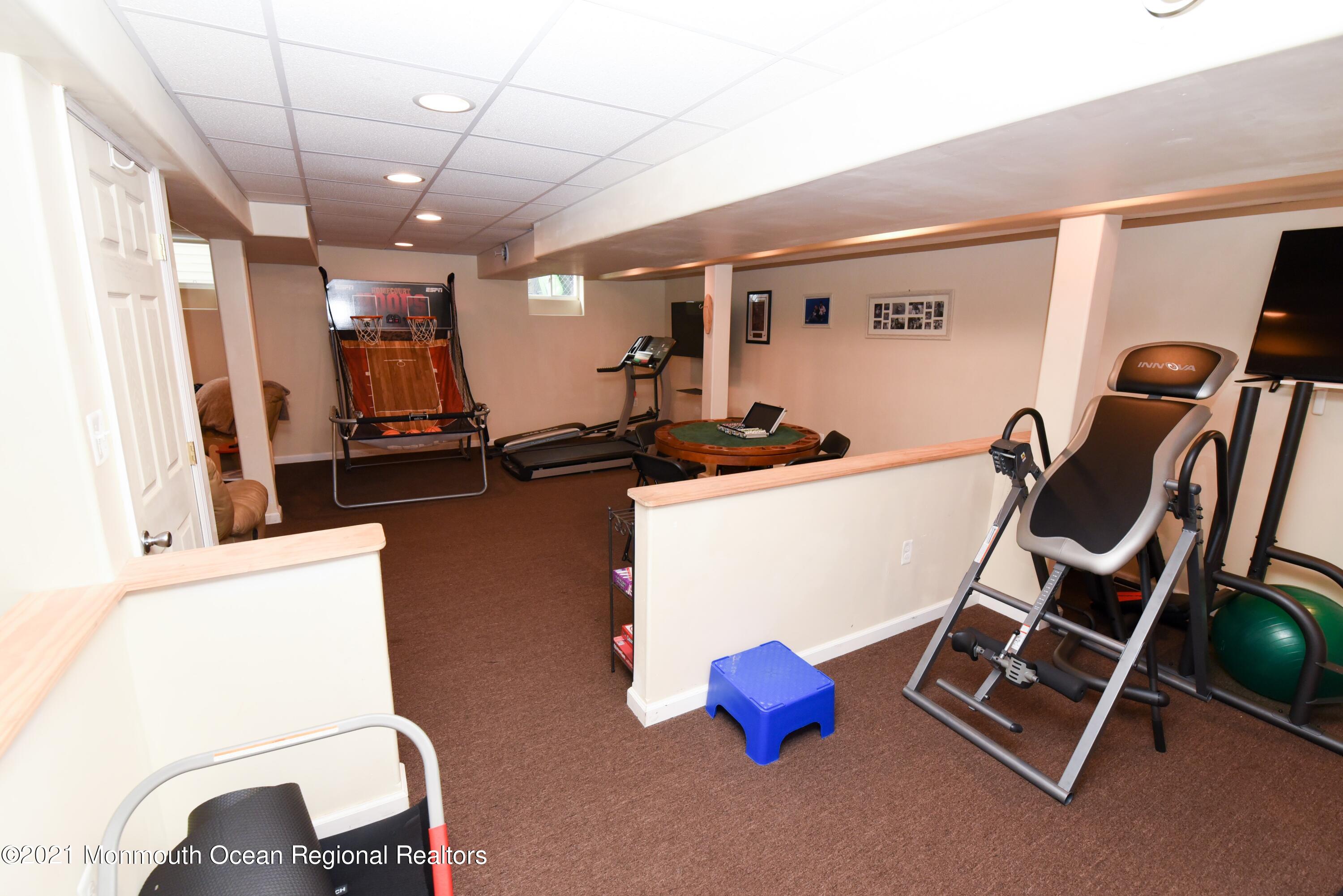 57 Mutineer Avenue Barnegat, NJ 08005 - Photo 59 of 89 a room with furniture and a flat screen tv