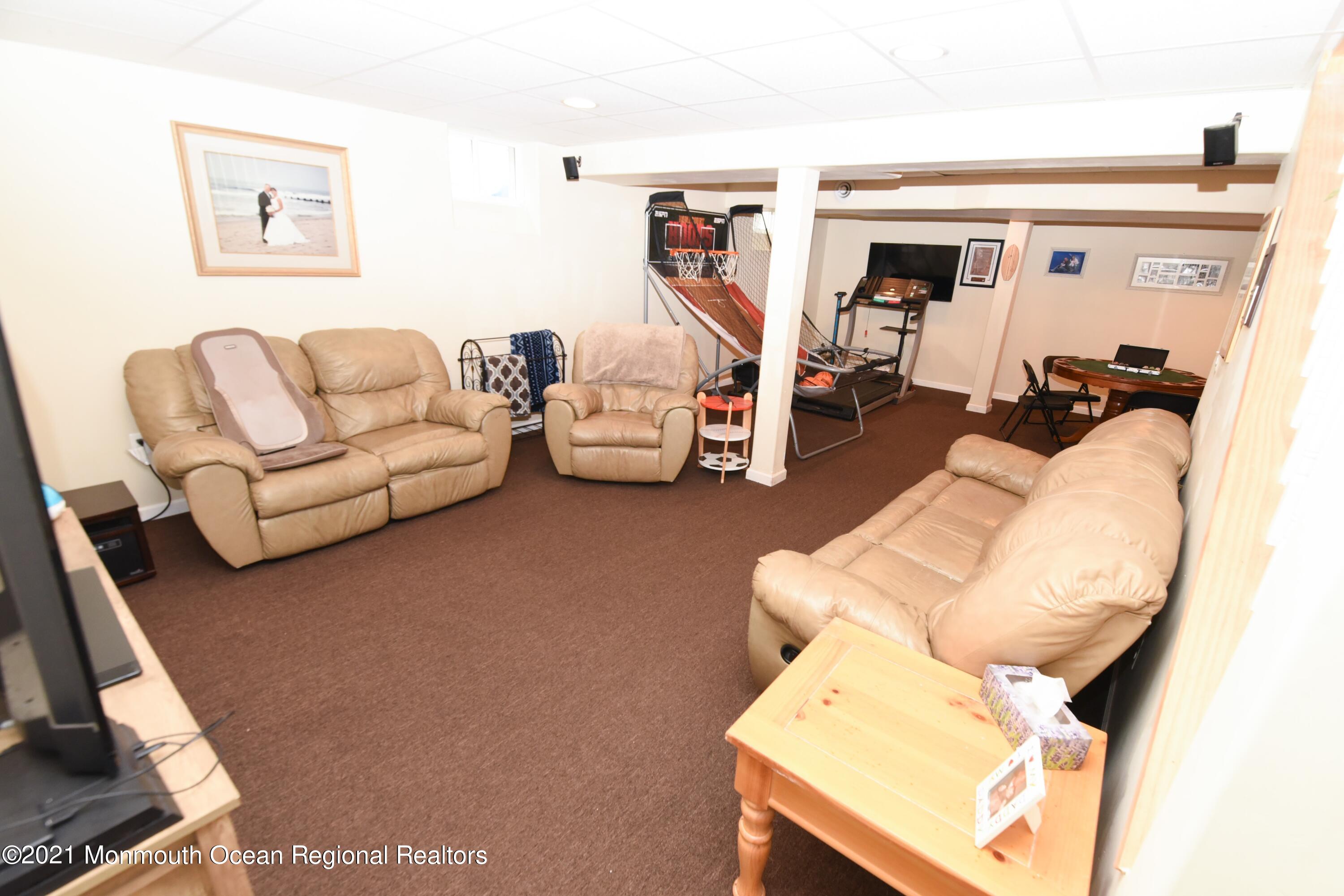 57 Mutineer Avenue Barnegat, NJ 08005 - Photo 65 of 89 a living room with furniture and a flat screen tv