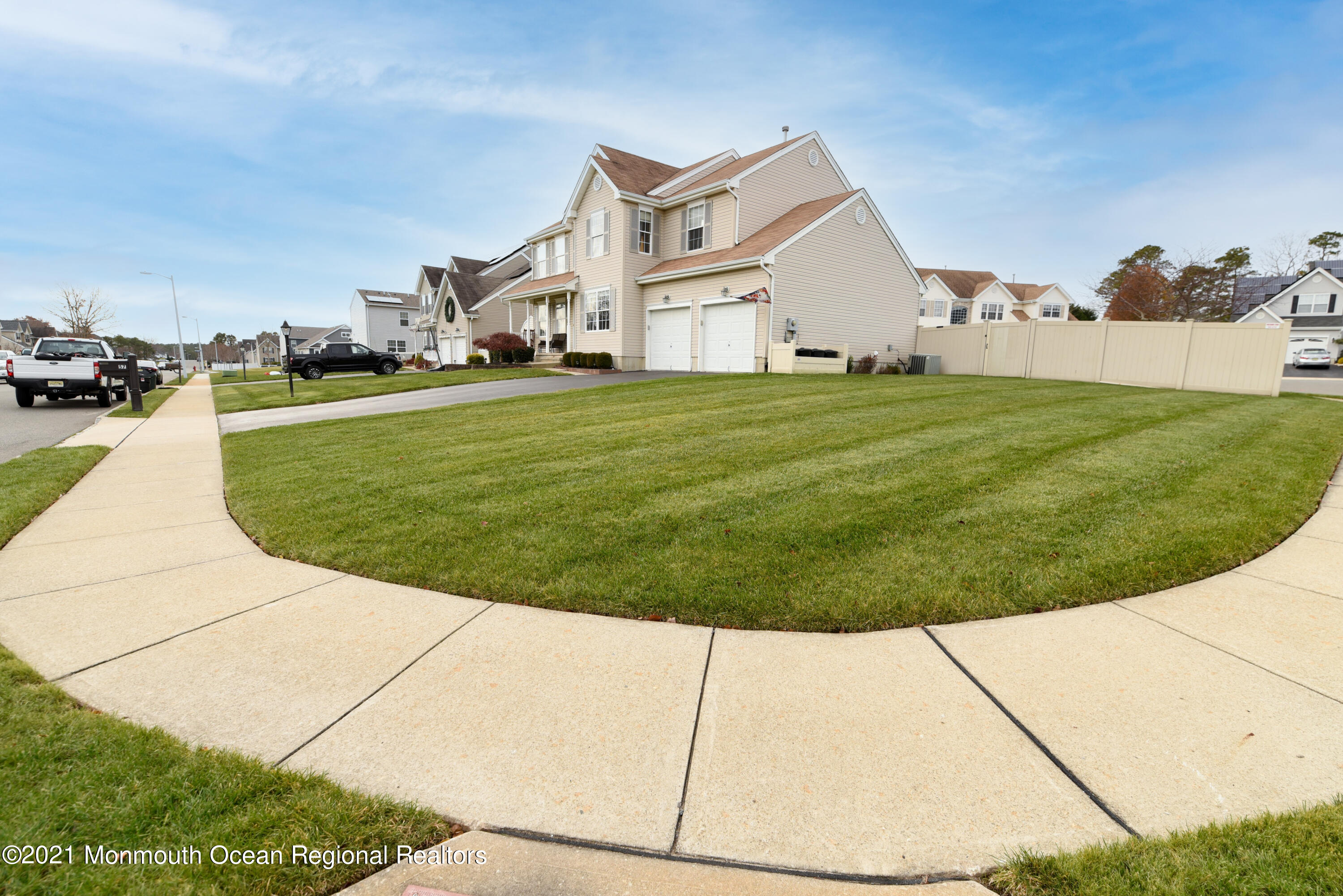 57 Mutineer Avenue Barnegat, NJ 08005 - Photo 9 of 89 a view of a white house with a big yard and potted plants