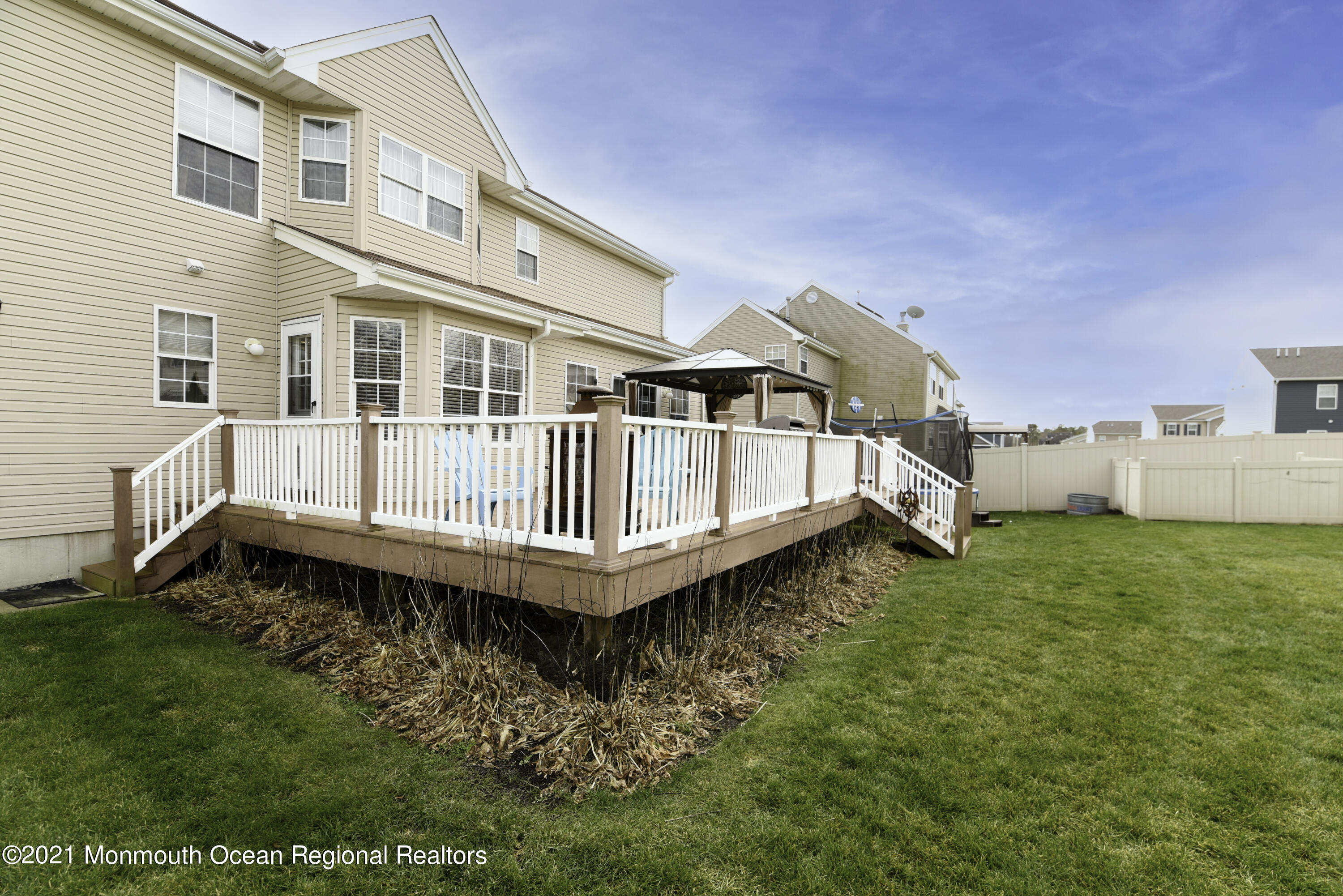 57 Mutineer Avenue Barnegat, NJ 08005 - Photo 87 of 89 a backyard of a house with a garden and deck