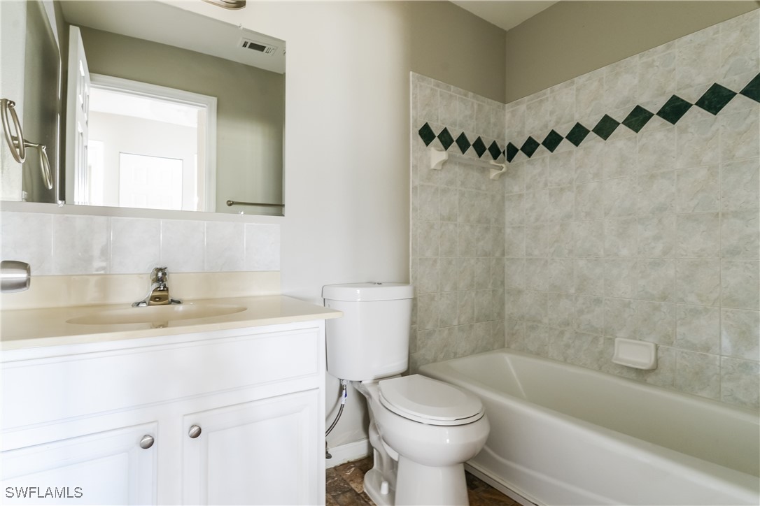 2809 Greendale Road North Port, FL 34287 - Photo 15 of 16 a bathroom with a sink a toilet and a bathtub