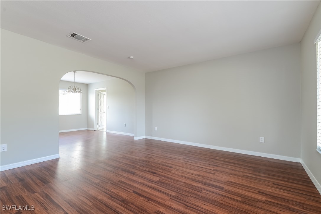 2809 Greendale Road North Port, FL 34287 - Photo 3 of 16 a view of an empty room with wooden floor and window